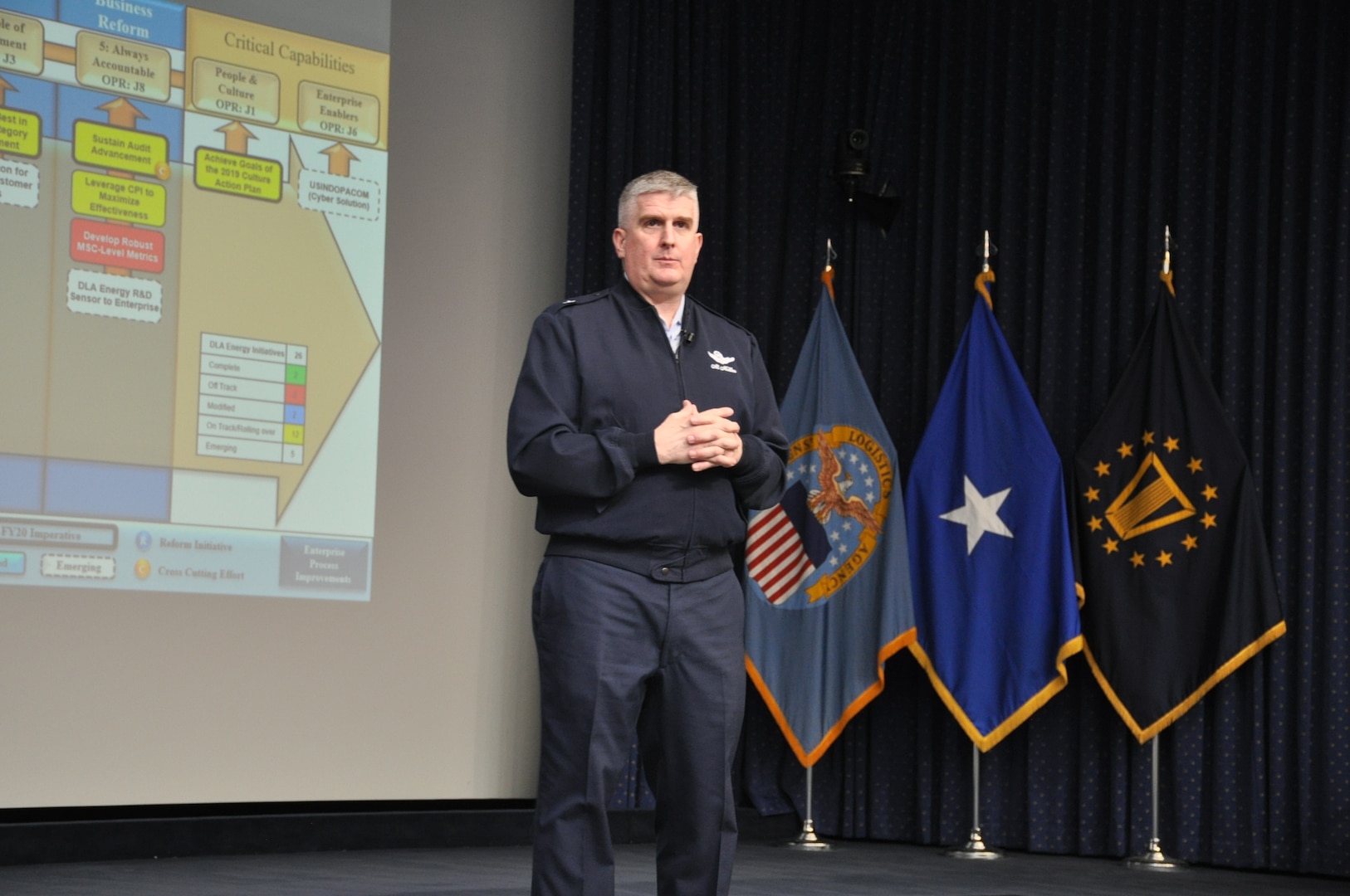 A general officer talks to an audience