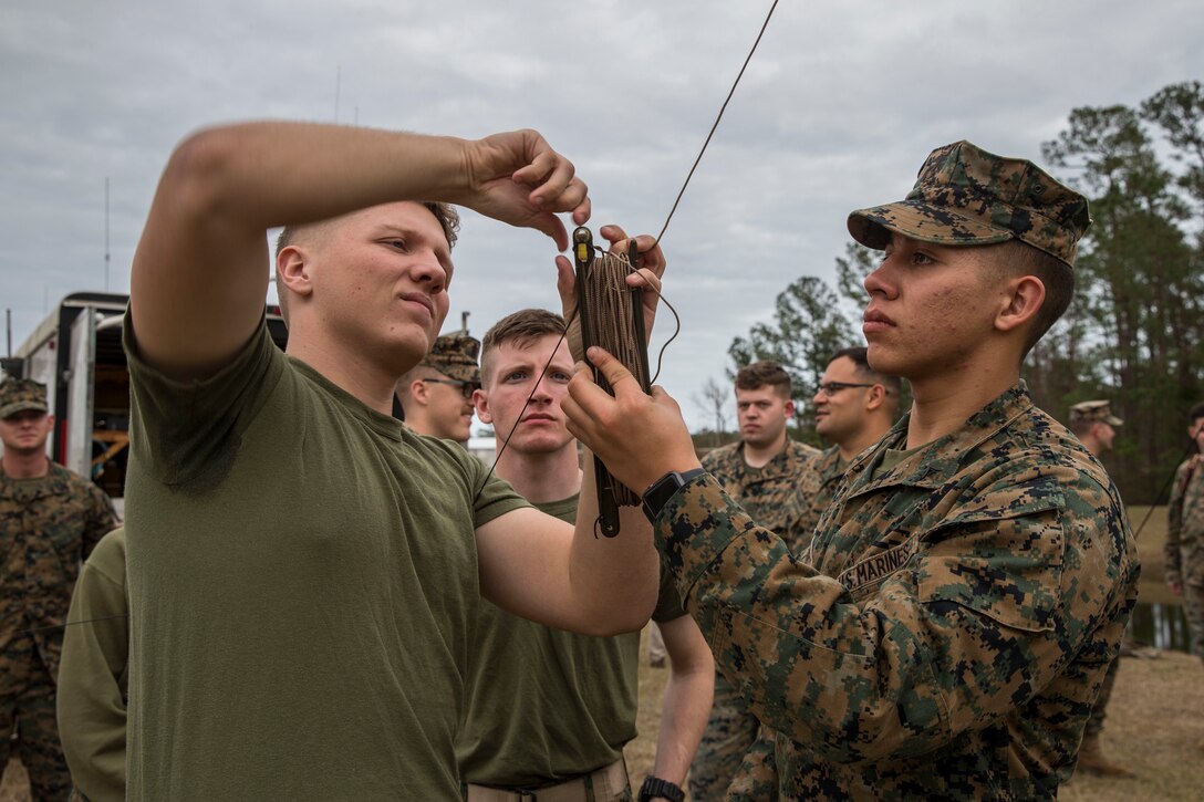 U.S. Marines with 2nd Radio Battalion and 8th Communication Battalion, II Marine Expeditionary Force Information Group, set up an antenna during a HAM Amateur Radio Licensing Course at Camp Lejeune, N.C., Jan. 10, 2020. The objective of the course was to increase knowledge on amateur radios and radio operating procedures in order to develop and enhance the Marines’ capabilities. (U.S. Marine Corps photo by Lance Cpl. Larisa Chavez)