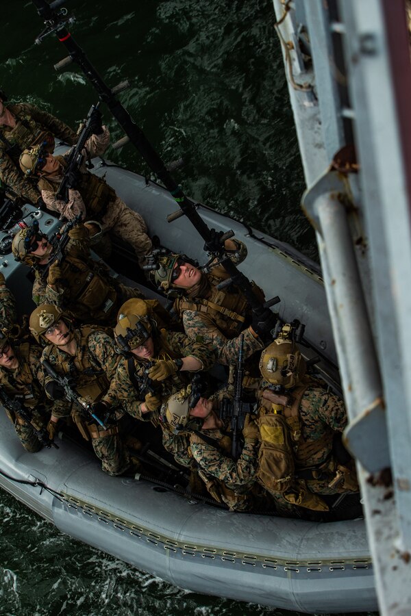 Marines prepare to board a vessel during Visit, Board, Search and Seizure training in Pearl Harbor, Hawaii, Jan. 9.
