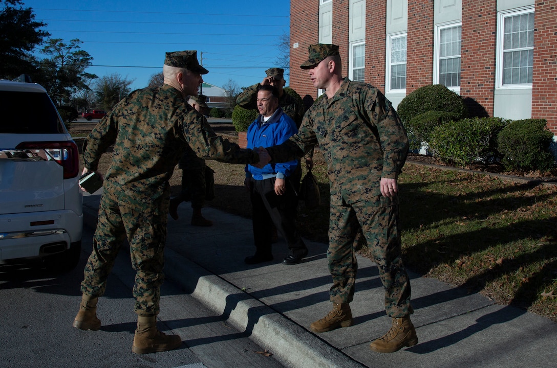 U.S. Marine Corps Sgt. Maj. Troy E. Black, left, the 19th sergeant major of the Marine Corps, greets Sgt. Maj. Bobby D. Frazier, right, sergeant major for Headquarters and Support Battalion, MCIEAST-MCB Camp Lejeune, during a visit to MCB Camp Lejeune, North Carolina, Jan. 8, 2020.