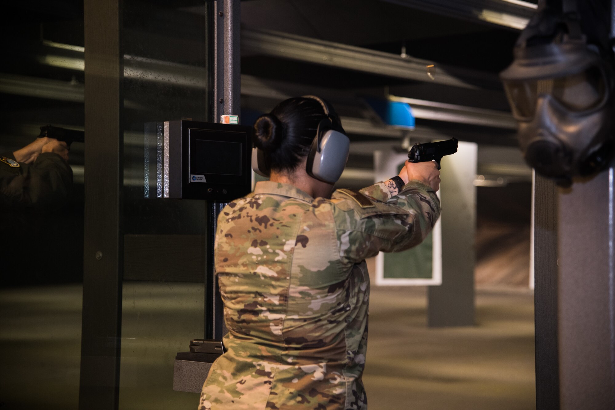 A Citizen Airman with the 932nd Airlift Wing fires an M9 pistol during an M9 Air Force Qualification Course, Jan. 11, 2020, Scott Air Force Base, Illinois. Combat arms instructors provide classroom lessons and hands-on training to refresh Airmen’s weapon knowledge. The course sharpens their weapon systems skills and ensures optimal performance of the firearms they carry daily. (U.S. Air Force photo by Senior Airman Brooke Deiters)