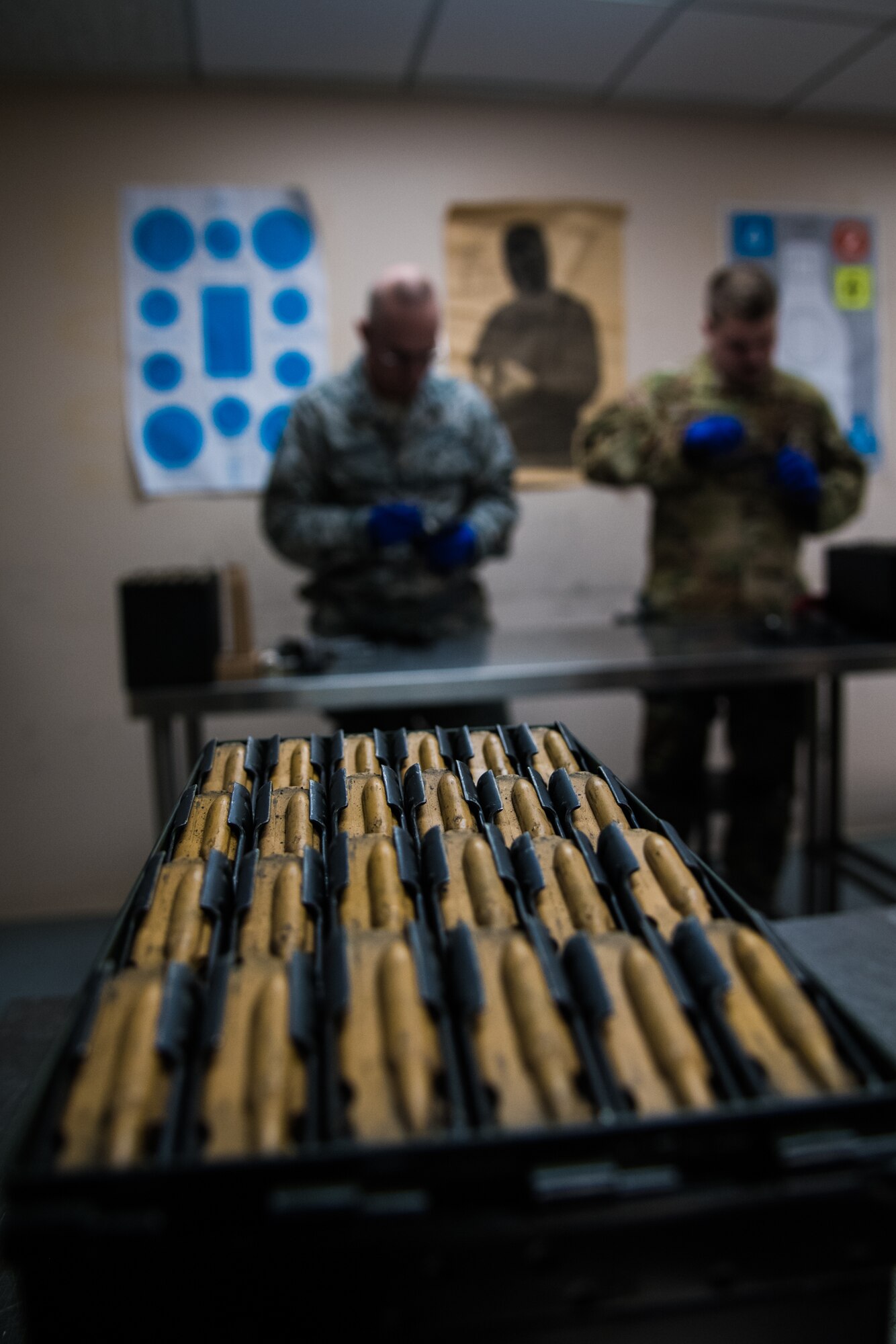 Citizen Airmen with the 932nd Airlift Wing clean weapons after participating in M-9 pistol qualification, Jan. 11, 2020, Scott Air Force Base, Illinois. Combat arms instructors provide classroom lessons and hands-on training to refresh Airmen’s weapon knowledge. The course sharpens their weapon systems skills and ensures optimal performance of the firearms they carry daily. (U.S. Air Force photo by Senior Airman Brooke Deiters)