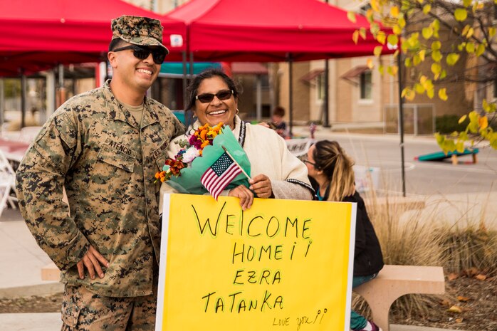 U.S. Marine Corps Sgt. Erza Atencio, Combat Logistics Battalion 11 (CLB-11), 11th Marine Expeditionary Unit, reunites with his mother during a homecoming on Camp Pendleton, California, Nov. 26, 2019.