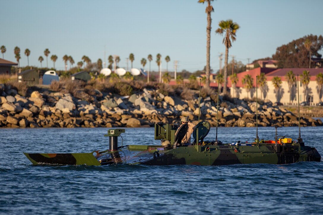 U.S. Marines with Amphibious Vehicle Test Branch, Marine Corps Tactical Systems Support Activity, test Amphibious Combat Vehicles along the beach during low-light surf transit testing at AVTB Beach on Marine Corps Base Camp Pendleton, California, Dec. 16, 2019.