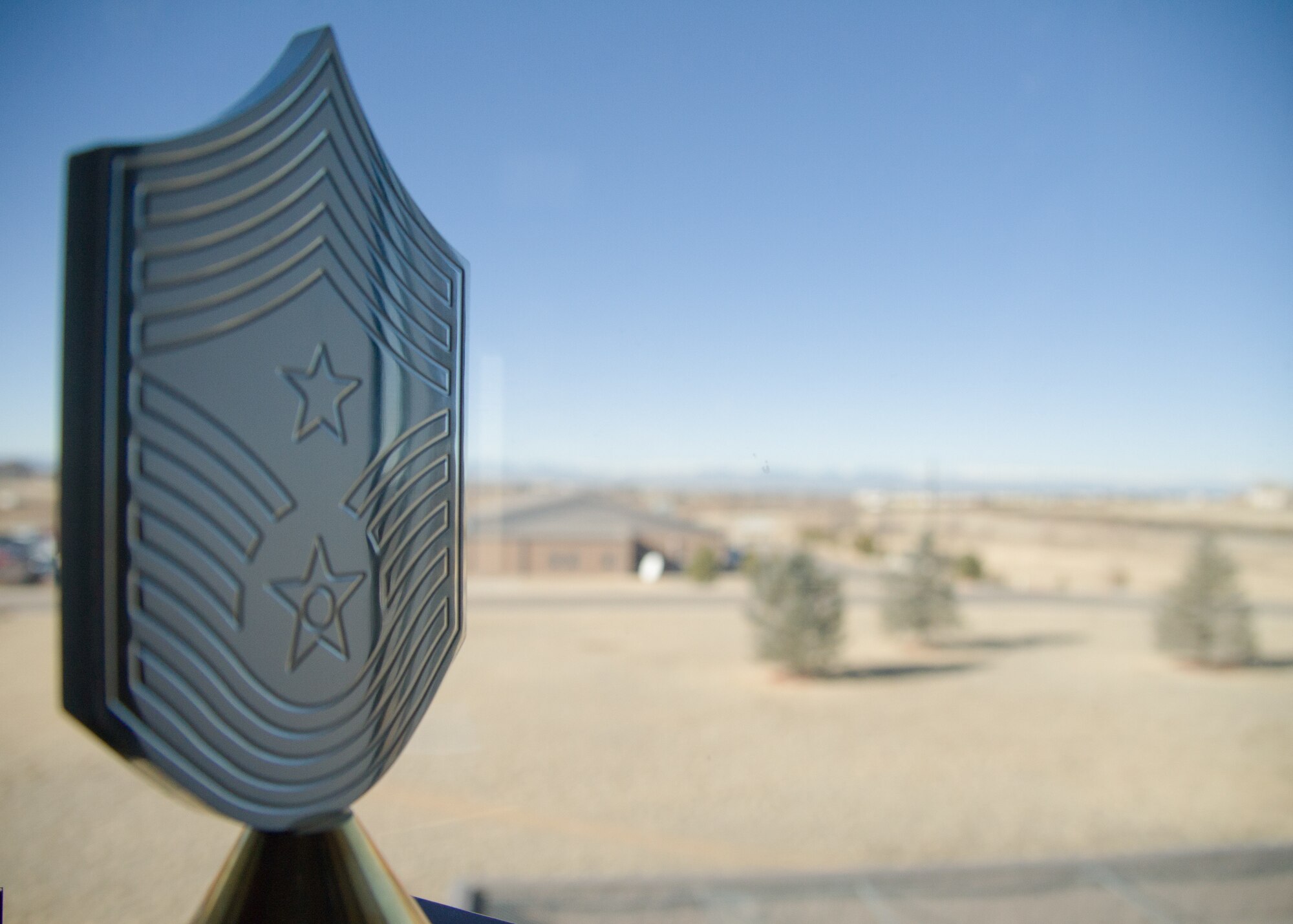 Command Chief trophy in window of a Headquarters Air Reserve Personnel Center office. (U.S. Air Force photo by Master Sgt. Leisa Grant/Released)