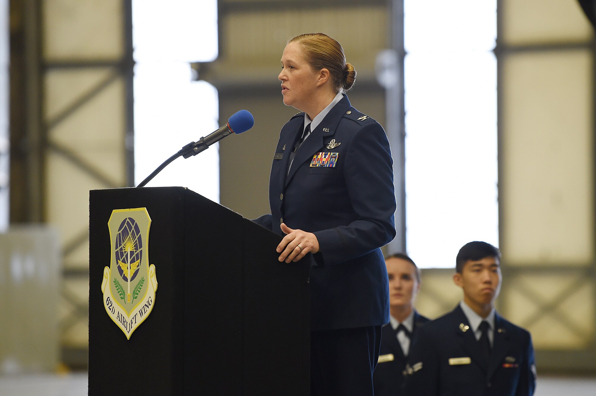 Col. Erin Staine-Pyne, 62nd Airlift Wing commander, speaks for the first time as the 62nd Airlift Wing commander to audience members at the change of command ceremony on Joint Base Lewis-McChord, Wash., Jan 10, 2020.