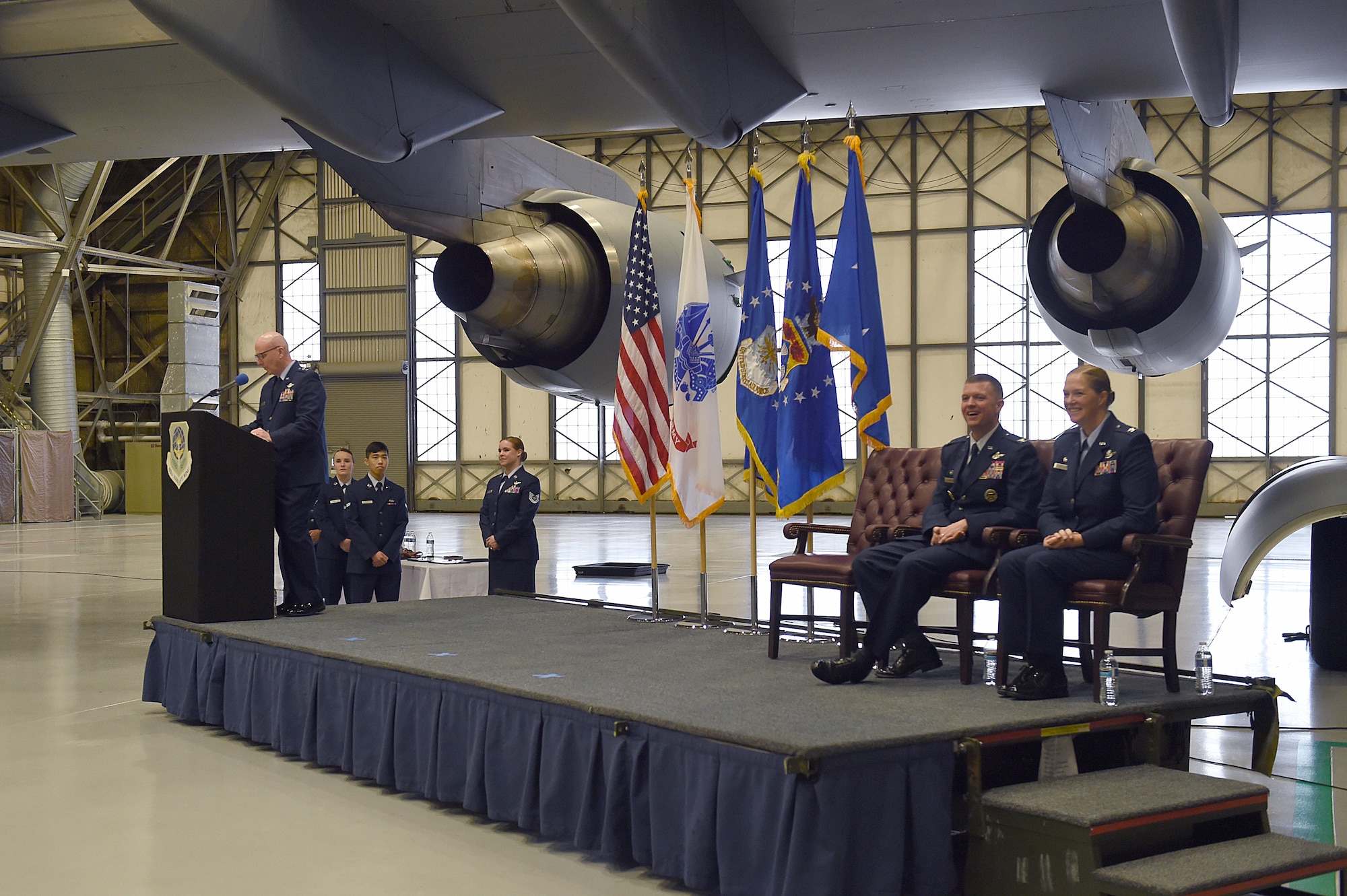 Maj. Gen. Sam Barrett, 18th Air Force commander, left, speaks at the 62nd Airlift Wing change of command on Joint Base Lewis-McChord, Wash., Jan. 10, 2020.
