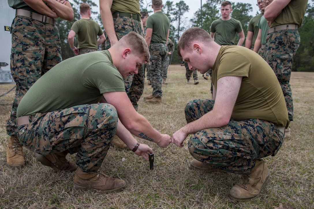 U.S. Marines with 2nd Radio Battalion and 8th Communication Battalion, II Marine Expeditionary Force Information Group, anchor an antenna during a HAM Amateur Radio Licensing Course at Camp Lejeune, N.C., Jan. 10, 2020. The objective of the course was to increase the Marines’ knowledge on amateur radios and radio operating procedures in order to develop and enhance their capabilities. (U.S. Marine Corps photo by Lance Cpl. Larisa Chavez)