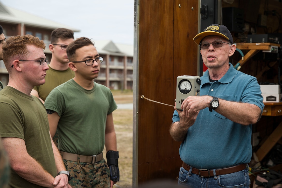 (Right) Dave Wood, president of the Brightleaf Amateur Radio Club instructs U.S. Marines with 2nd Radio Battalion and 8th Communication Battalion, II Marine Expeditionary Force Information Group, on amateur radios during a HAM Amateur Radio Licensing Course at Camp Lejeune, N.C., Jan. 10, 2020. The objective of the course was to increase knowledge on amateur radios and radio operating procedures in order to develop and enhance the Marines’ capabilities. (U.S. Marine Corps photo by Lance Cpl. Larisa Chavez)