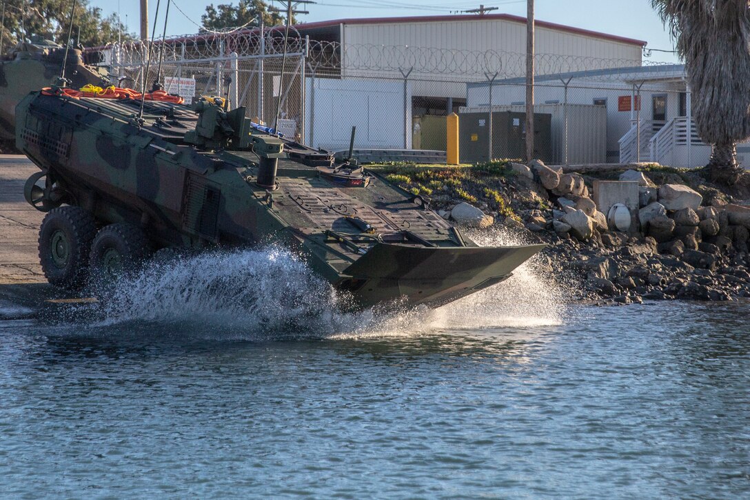 U.S. Marines with Amphibious Vehicle Test Branch, Marine Corps Tactical Systems Support Activity, test Amphibious Combat Vehicles along the beach during low-light surf transit testing at AVTB Beach on Marine Corps Base Camp Pendleton, California, Dec. 16, 2019