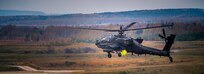 An AH-64 from Charlie Company, 1-3rd Attack Reconnaissance Battalion fires a rocket during live fire training at Grafenwoehr training area.