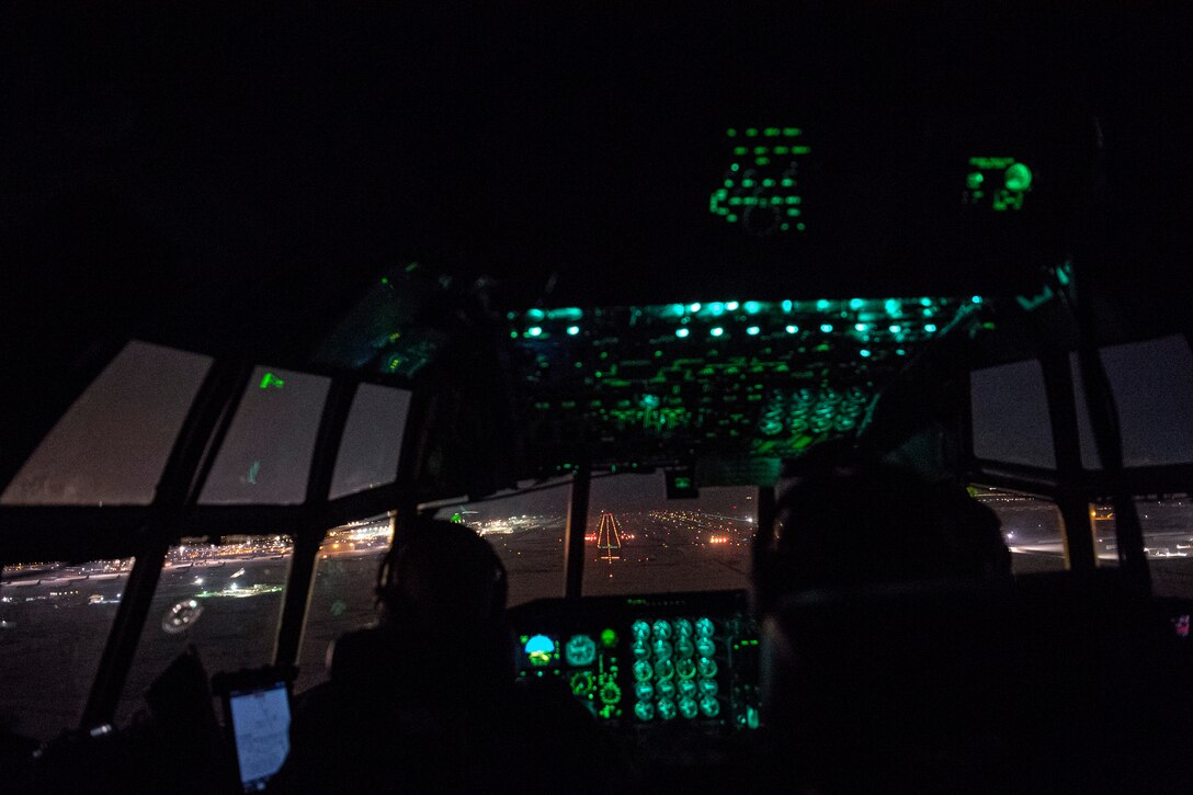 U.S. Air Force pilots assigned to the 746th Expeditionary Airlift Squadron prepare to land a C-130 Hercules within the U.S. Central Command area of responsibility, Jan. 8, 2020.