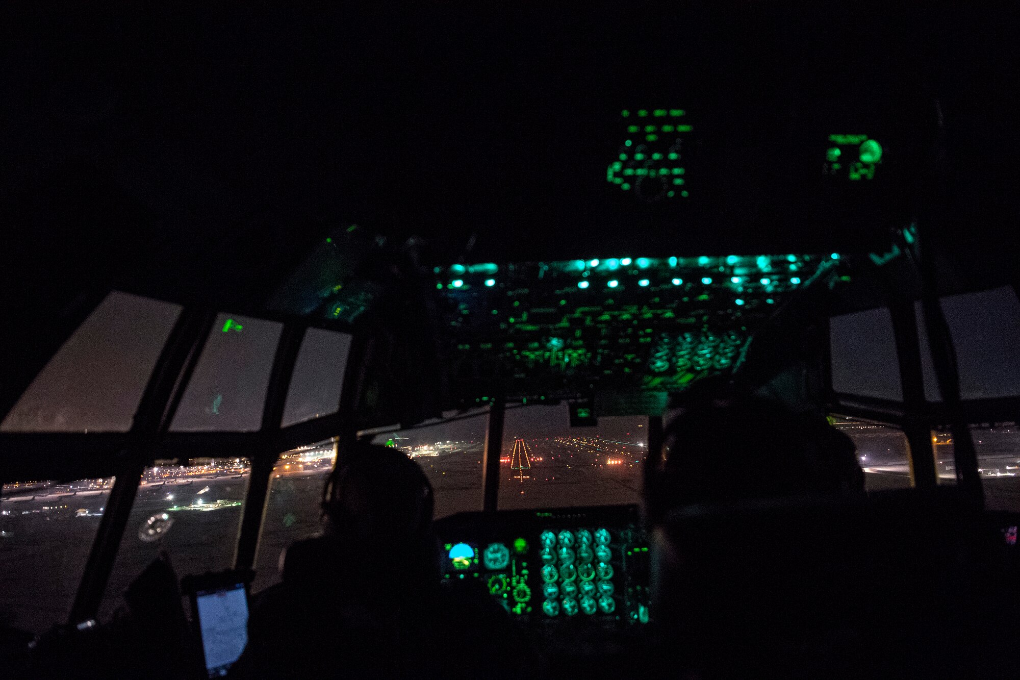 U.S. Air Force pilots assigned to the 746th Expeditionary Airlift Squadron prepare to land a C-130 Hercules within the U.S. Central Command area of responsibility, Jan. 8, 2020.