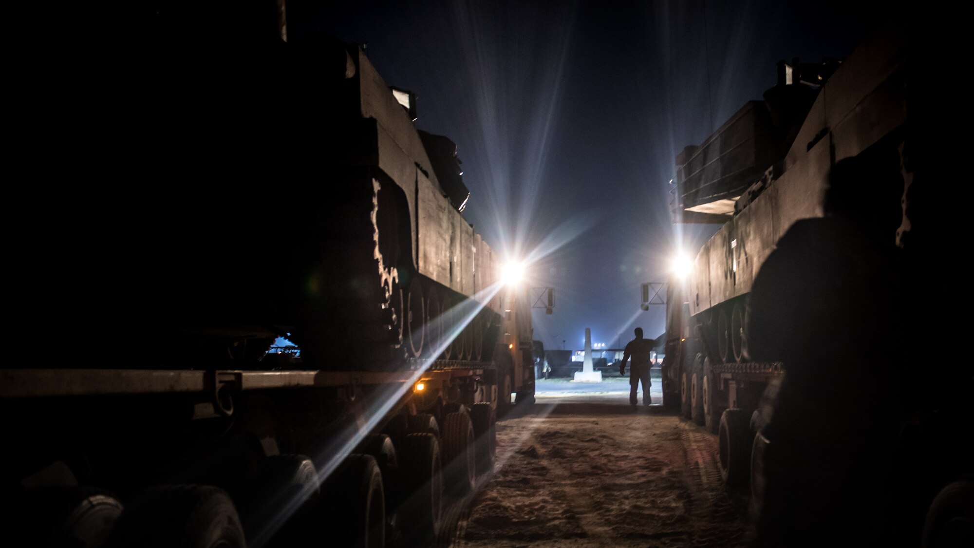U.S. Army Soldiers prepare to unload two M2 Bradley Fighting Vehicles in the U.S. Central Command area of responsibility, Jan. 3, 2020. USCENTCOM directs and enables military operations and activities with allies and partners to increase regional security and stability in support of enduring U.S. interests. (U.S. Air Force photo by Tech. Sgt. Daniel Martinez)