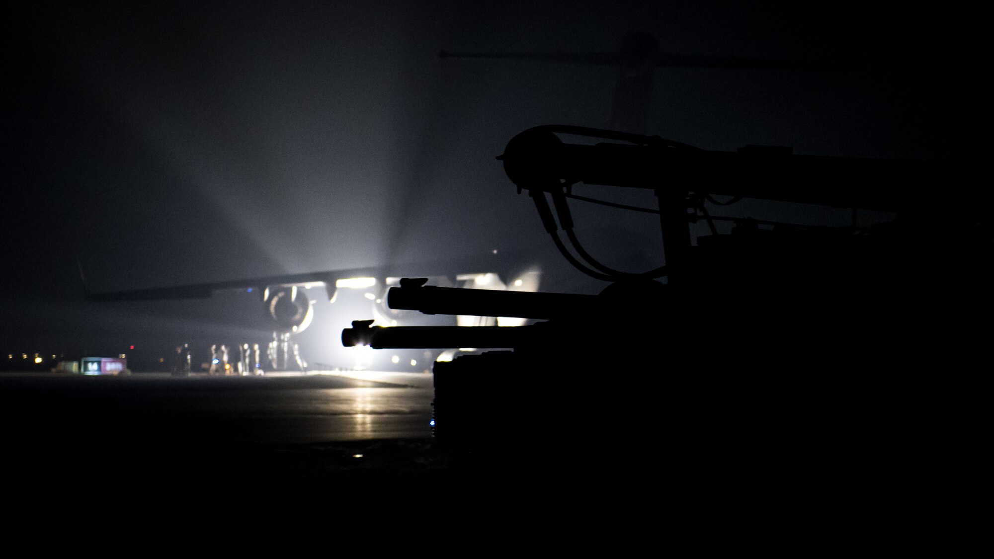 U.S. Army M1A1 Abrams tanks are parked next to a flight line in the U.S. Central Command area of responsibility, Jan. 3, 2020. USCENTCOM directs and enables military operations and activities with allies and partners to increase regional security and stability in support of enduring U.S. interests. (U.S. Air Force photo by Tech. Sgt. Daniel Martinez)