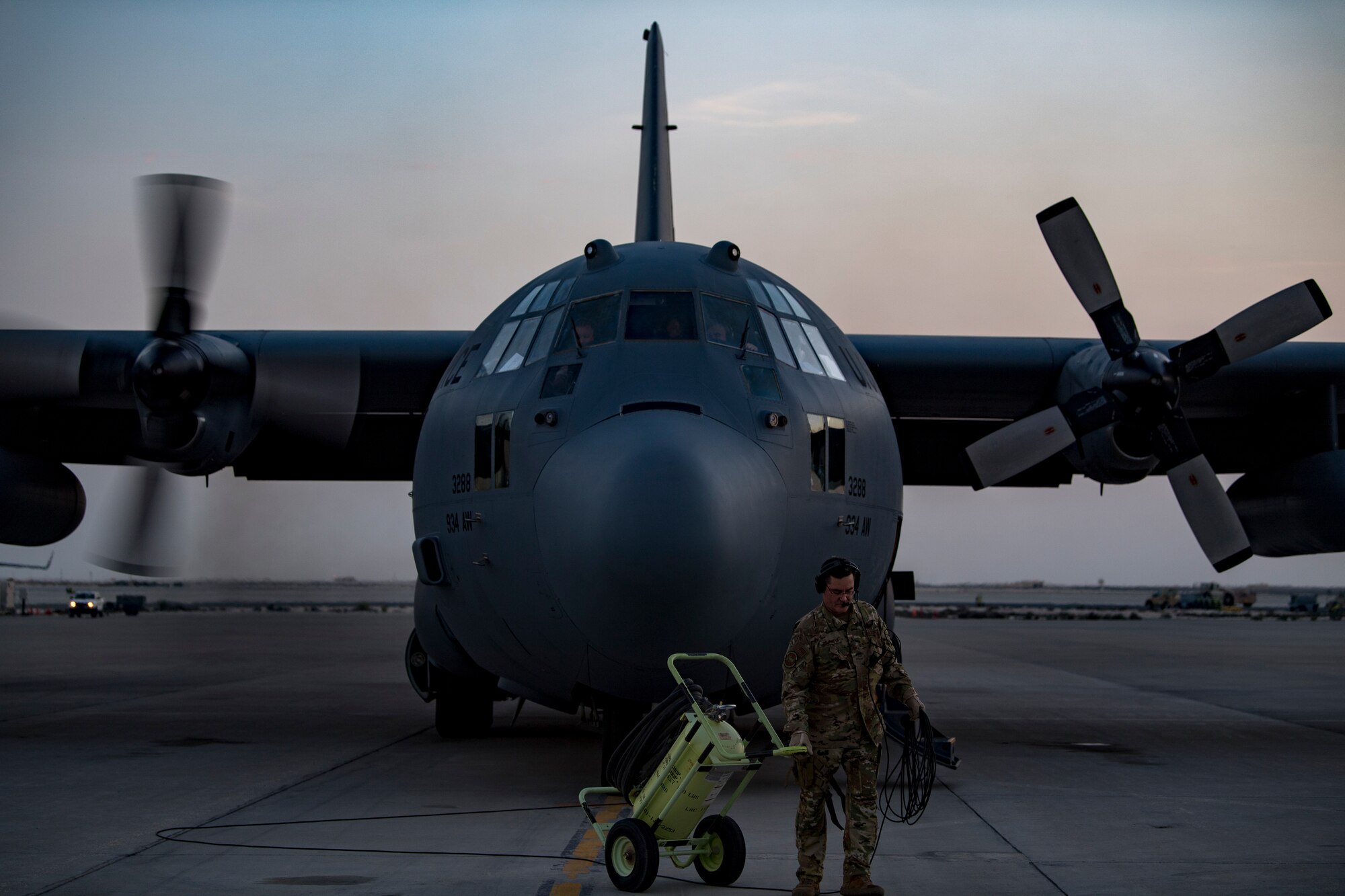 U.S. Air Force aircrew members assigned to the 746th Expeditionary Airlift Squadron conduct preflight checks of a C-130 Hercules in the U.S. Central Command area of responsibility, Jan. 8, 2020.