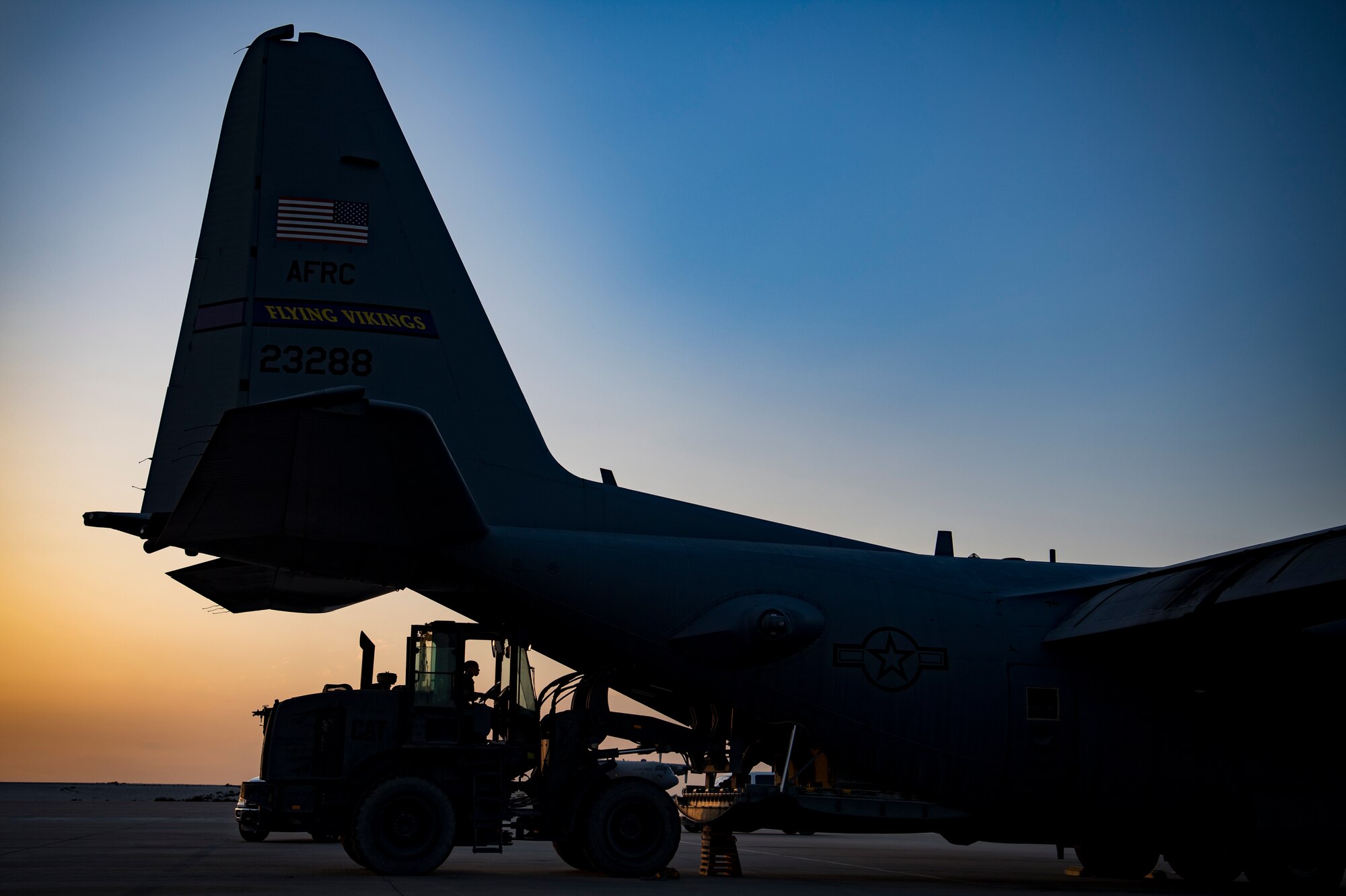 A U.S. Air Force aerial porter assigned to the 746th Expeditionary Logistics Readiness Squadron loads cargo into a C-130 Hercules in the U.S. Central Command area of responsibility, Jan. 8, 2020.