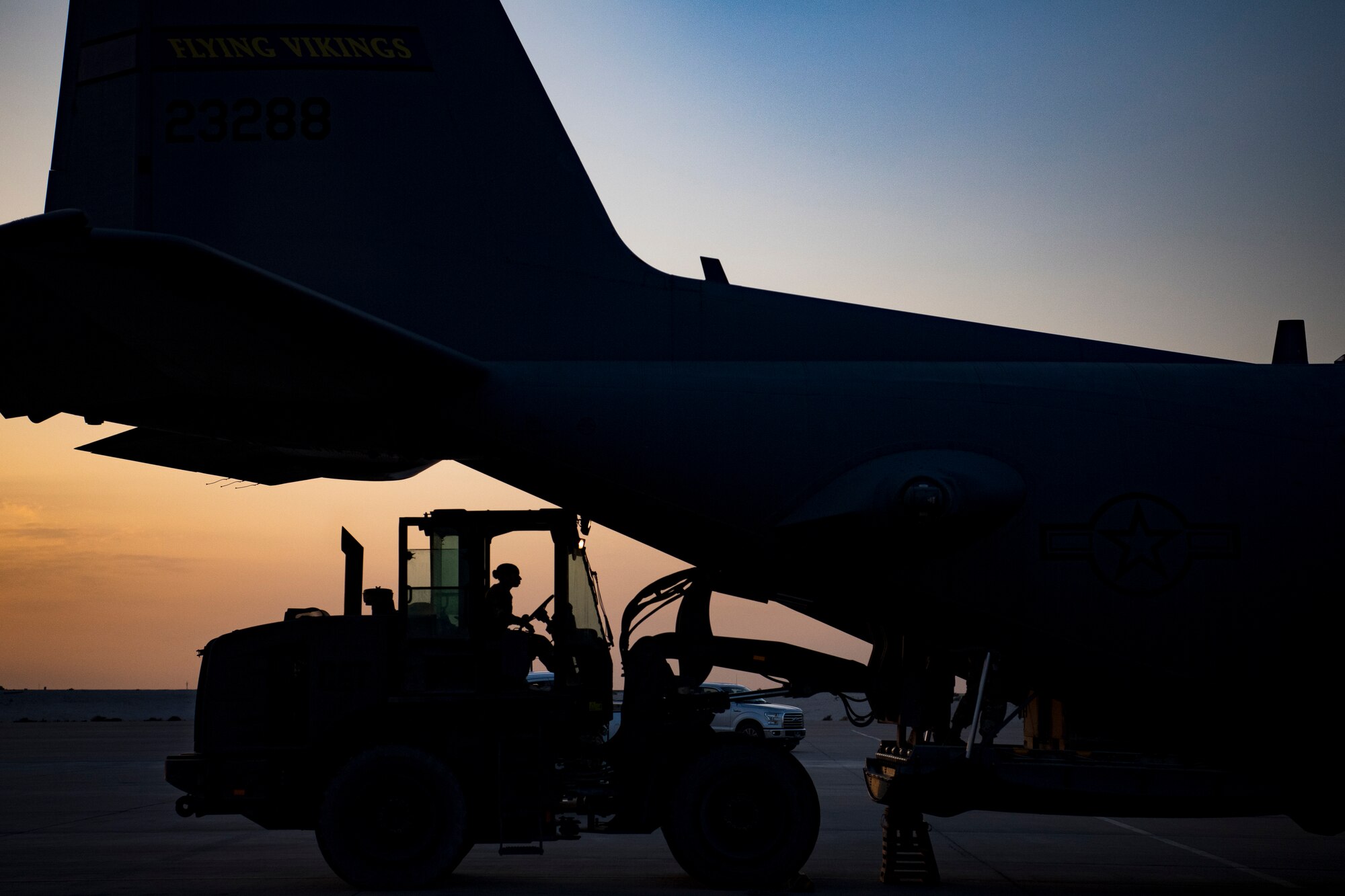 A U.S. Air Force aerial porter assigned to the 746th Expeditionary Logistics Readiness Squadron loads cargo into a C-130 Hercules in the U.S. Central Command area of responsibility, Jan. 8, 2020.