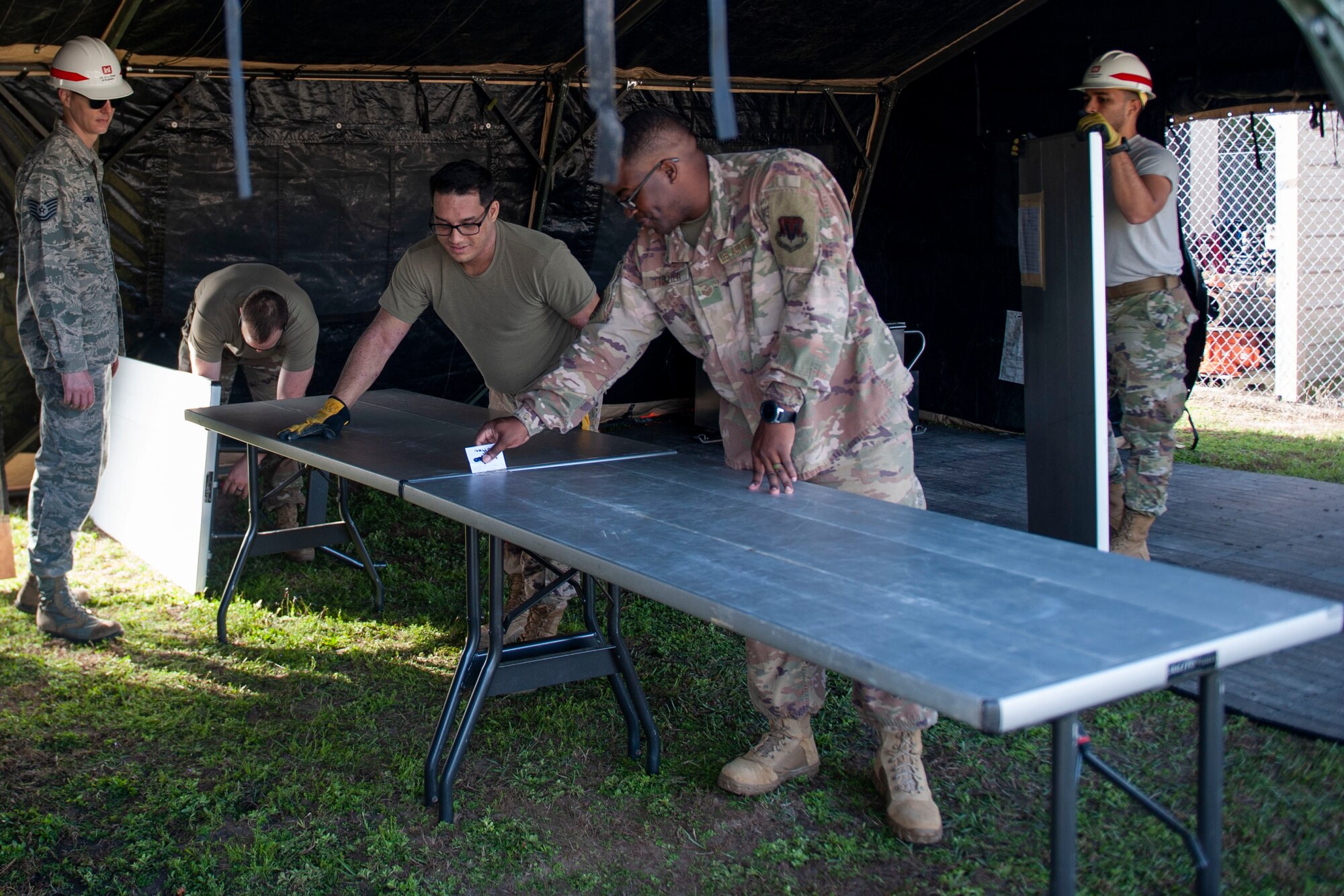 Photo of Airmen setting up tables