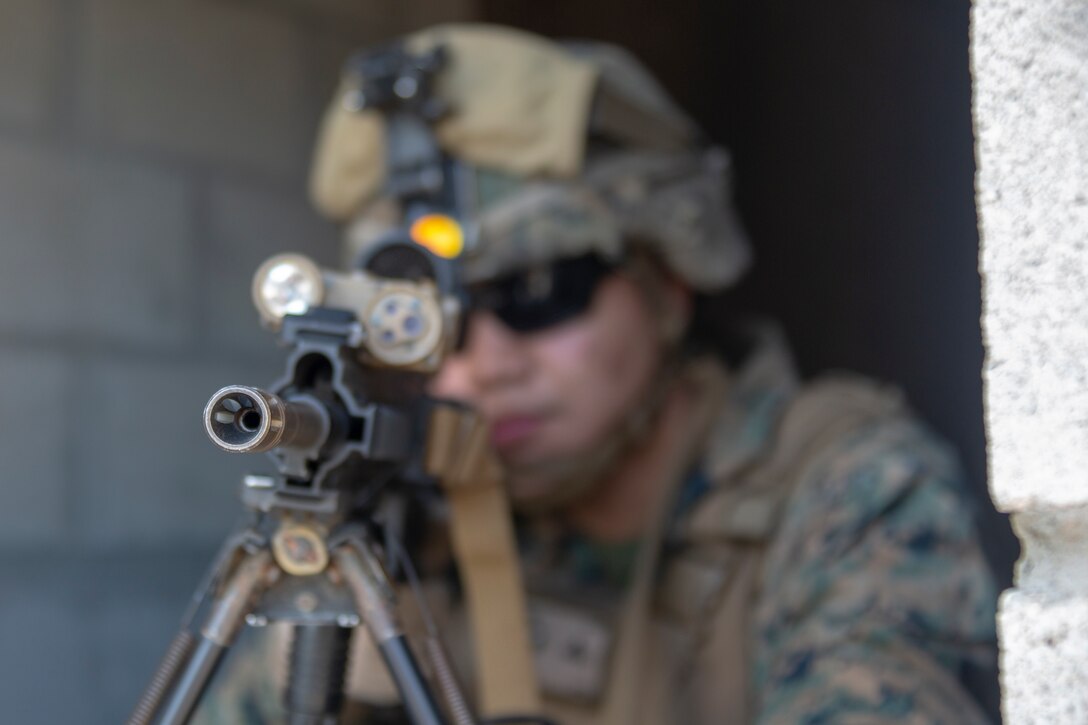 A U.S. Marine with the Special Purpose Marine Air-Ground Task Force-Crisis Response-Africa 20.1, Marine Forces Europe and Africa, posts security during a military operations in urban terrain training event at Naval Station Rota, Spain, Jan. 9, 2020. The purpose of MOUT is to maintain mission readiness while providing scenarios that allow Marines and Sailors to practice their combat capabilities. SPMAGTF-CR-AF is deployed to conduct crisis-response and theater-security operations in Africa and promote regional stability by conducting military-to-military training exercises throughout Europe and Africa. (U.S. Marine Corps photo by Cpl. Kenny Gomez)