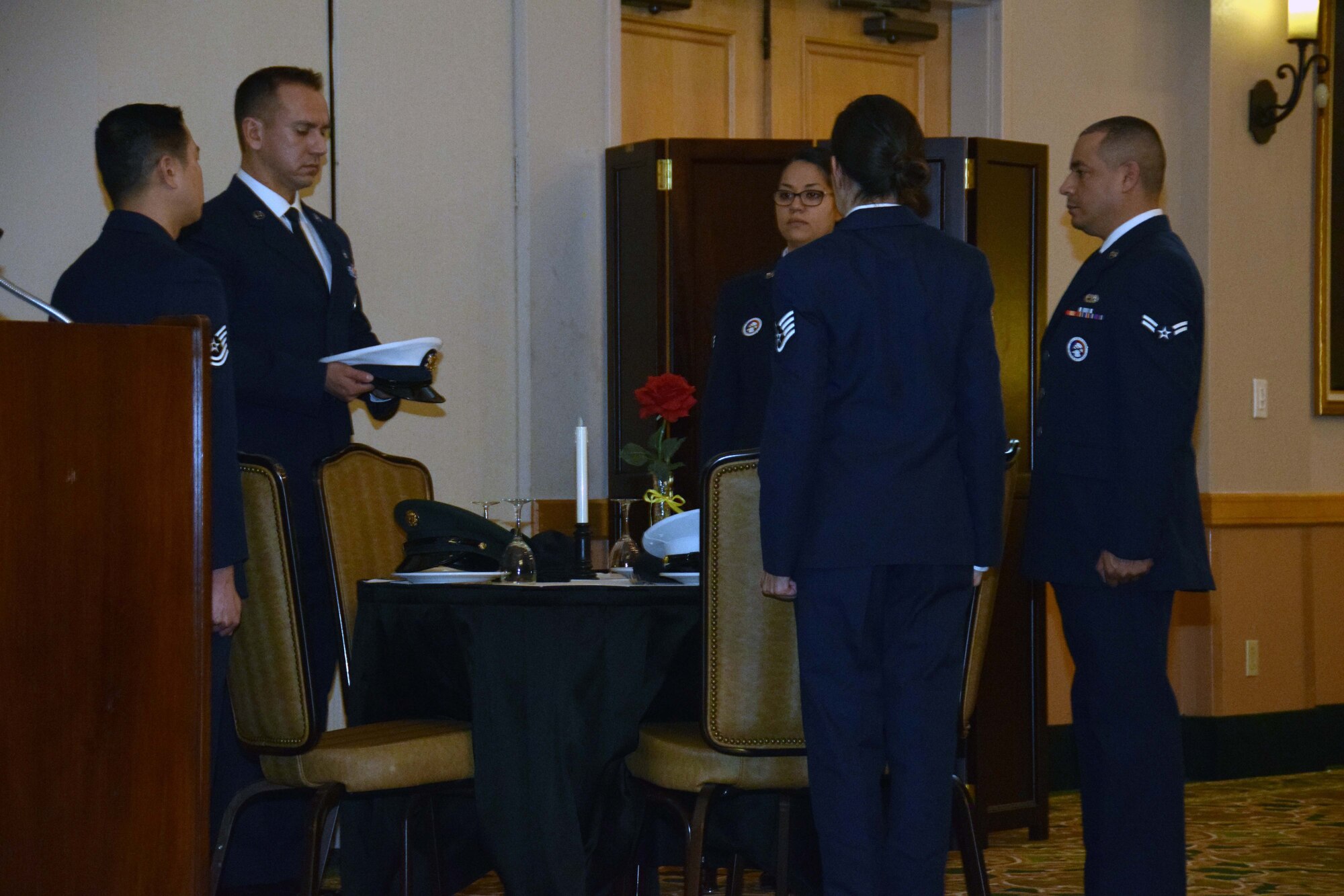 433rd Airlift Wing Honor Guard members perform a ceremony to honor prisoners of war and those missing in action at the start of the wing annual awards banquet Jan. 11, 2020 at the Gateway Club at Joint Base San Antonio-Lackland, Texas.