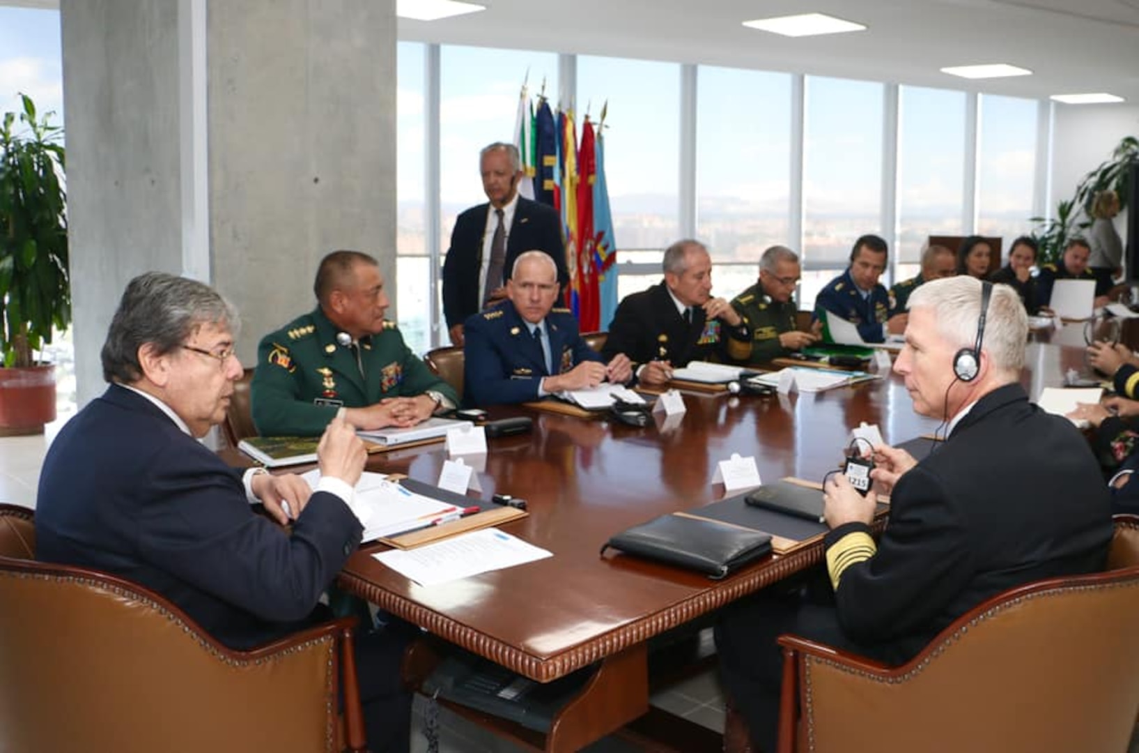 Colombian Minister of Defense Carlos Holmes Trujillo and U.S. Navy Adm. Craig S. Faller meet at a table.