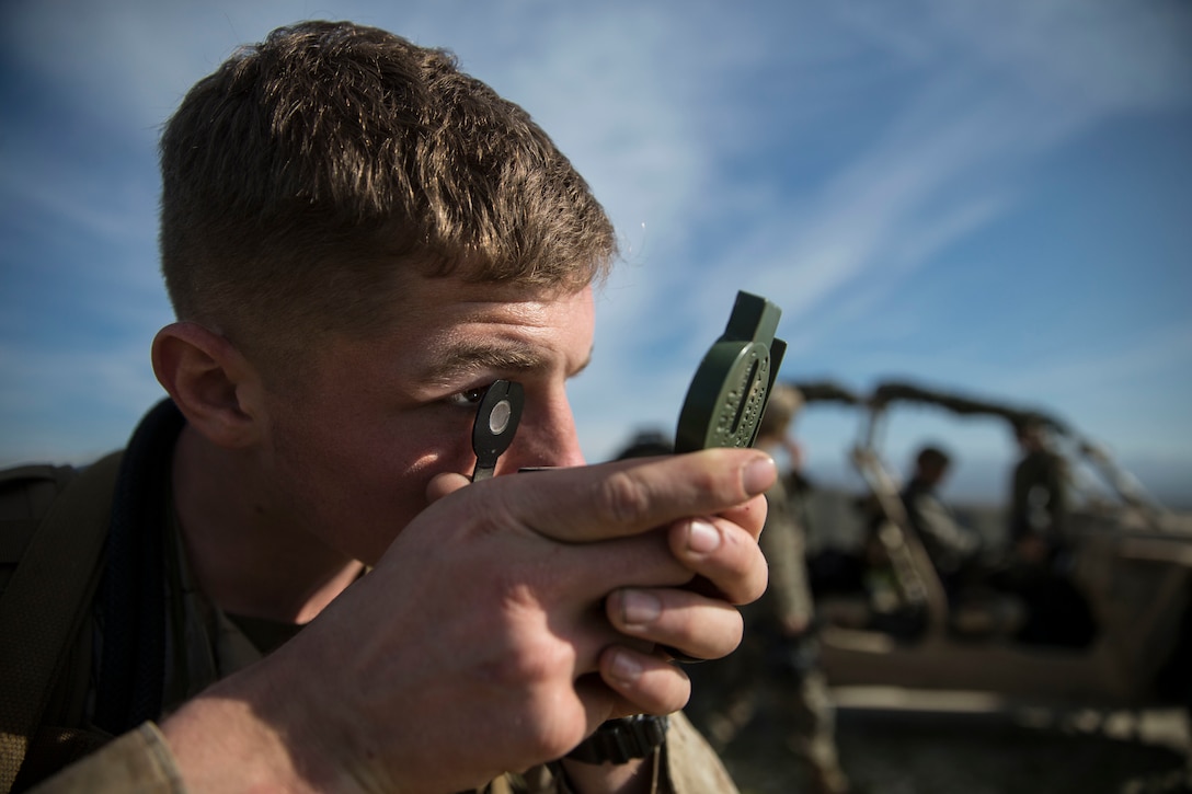 U.S. Marine shoots an azimuth with a lensatic compass during a land navigation evaluation on Marine Corps Base Camp Pendleton, California, Jan. 15.