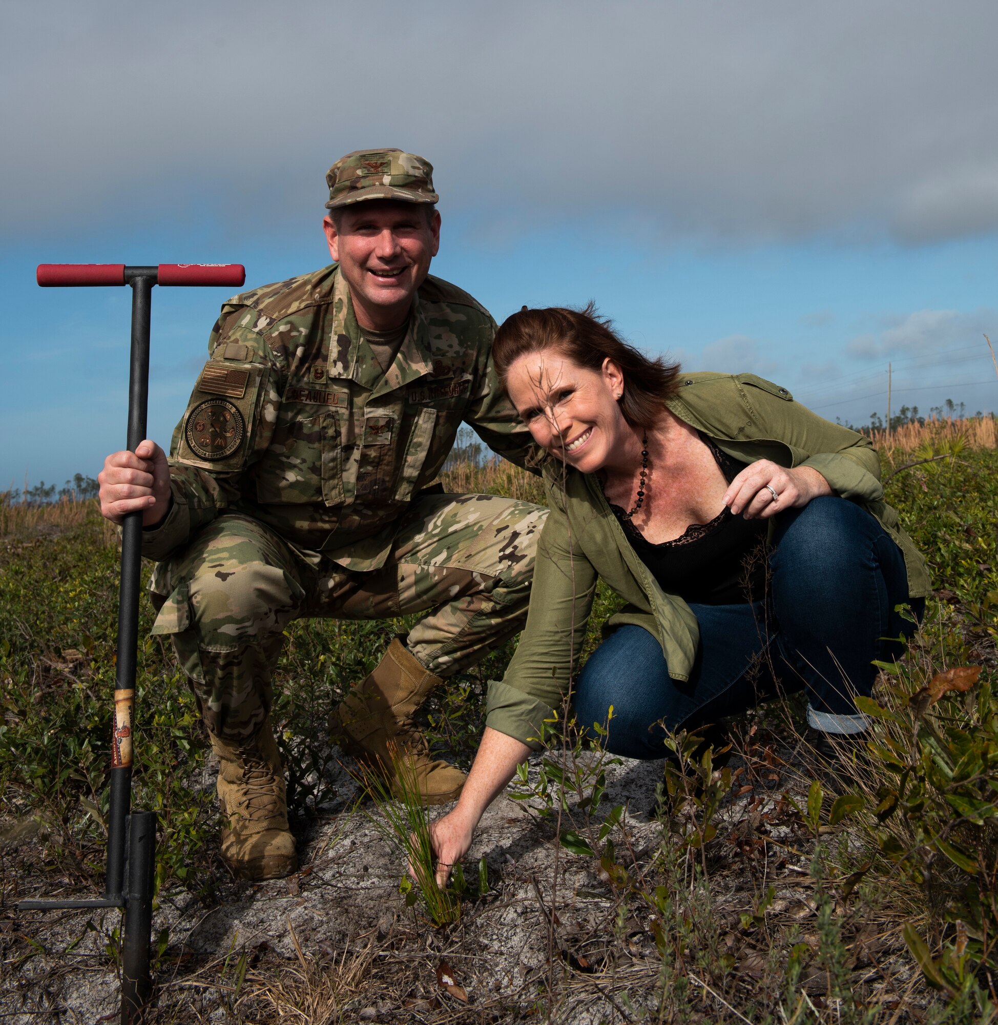 U.S. Air Force Col. Gregory Beaulieu, 325th Mission Support Group commander poses for a photo with his spouse, Amy, at Tyndall Air Force Base, Florida, Jan 15, 2020. The couple planted a longleaf pine tree as part of a long term, large scale project to restore Tyndall's ecosystem after the devastation caused by Category 5 Hurricane Michael in 2018. (U.S. Air Force photo by Staff Sgt. Magen M. Reeves)