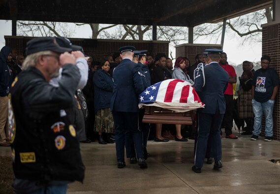 Columbus Air Force Base Honor Guardsmen salute as a hearse carrying the body of Staff Sgt. Tharin McNichols passes at the Mississippi Veterans Memorial Cemetery on Jan. 13, 2020, in Newton County, Miss. McNichols was a member of the 855th Aircraft Maintenance Squadron at Nellis Air Force Base, Nev. The honor guard’s primary mission is to provide military honors to fallen service members, but they also perform at official Air Force ceremonies and parades. (U.S. Air Force photo by Airman Davis Donaldson)