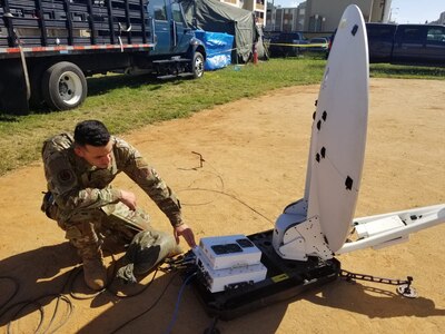 U.S. Air Force Staff Sgt. Kelvin Matos with the 156th Communications Flight, Puerto Rico Air National Guard, powers up the SATCOM Hawkeye II satellite dish to provide the Joint Incident Site Communications Capability’s voice, data, network and commercial internet capabilities at the Guanica base camp “tent city” to support victims of earthquakes that shook Puerto Rico in December 2019 and January 2020.