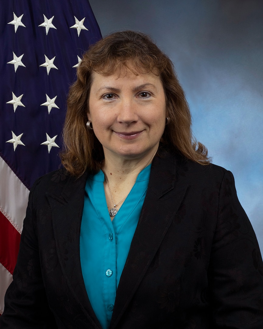 Official photo in front of American flag and blue background