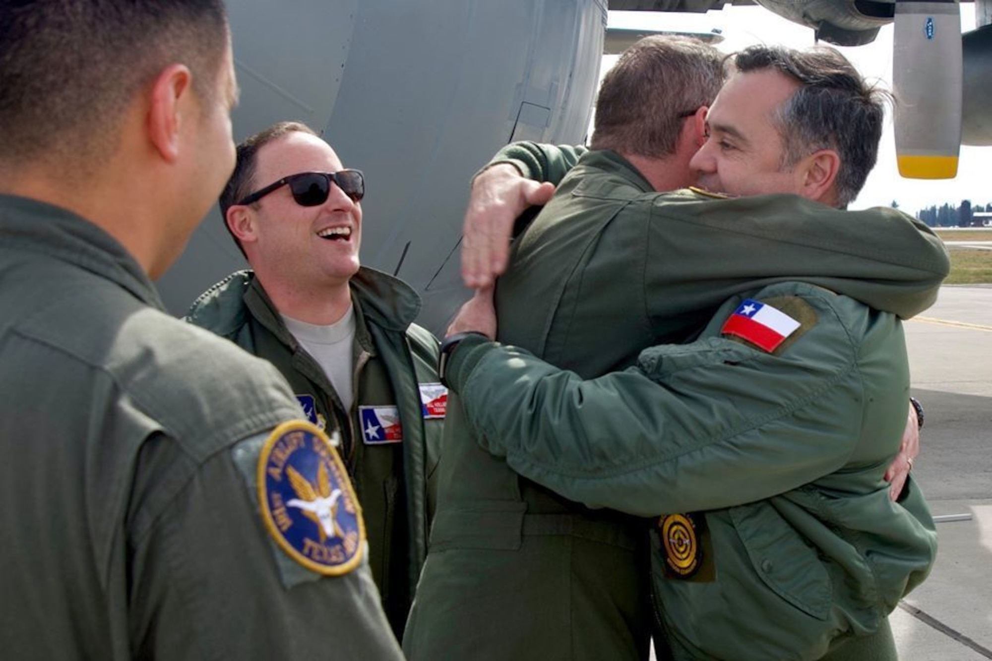 136th Airlift Wing and Chilean Air Force celebrate together after a successful mission.