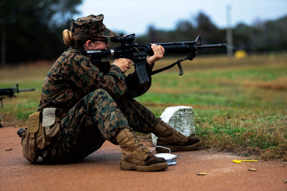 A Marine fires a rifle.