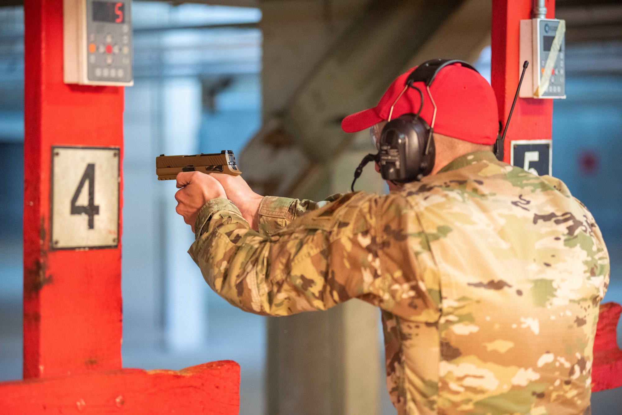 Tech. Sgt. Matt Leake, 22nd Security Forces Squadron combat arms training and maintenance instructor, aims an M18 pistol down range Jan. 10, 2019, at McConnell Air Force Base, Kansas. Security Forces recently acquired the new modular handgun to phase out the M9 pistol. (U.S. Air Force photo by Staff Sgt. Chris Thornbury)