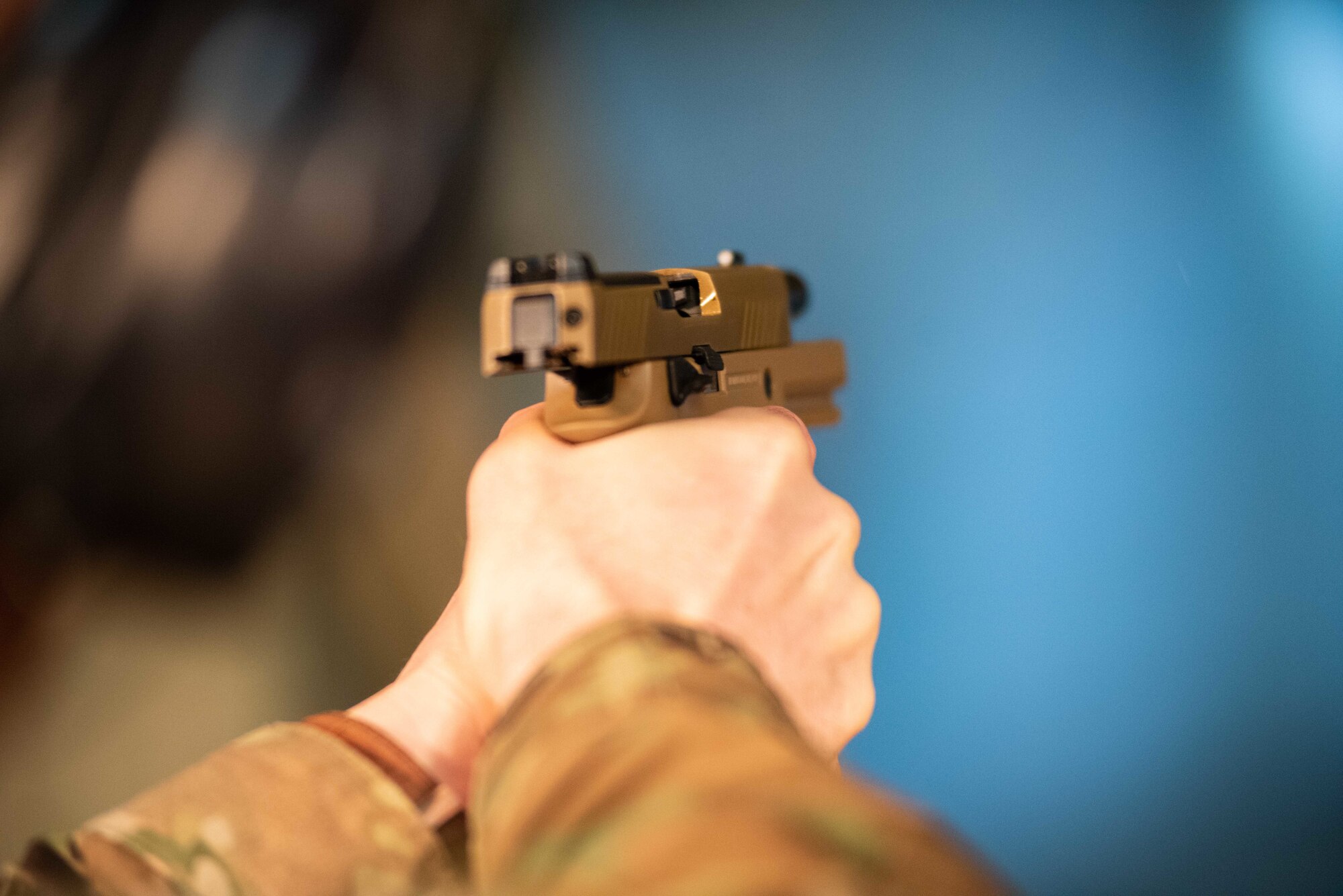 An M18 pistol’s slide locks to the rear after the last round of the magazine is fired Jan. 10, 2019, at McConnell Air Force Base, Kansas. The sidearm features interchangeable grips to best fit the user’s hand. (U.S. Air Force photo by Staff Sgt. Chris Thornbury)