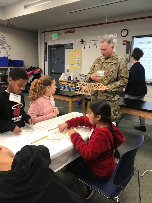 TAM Commander COL Philip Secrist shows an example of another bridge built my the daughter of a past commander. The bridge is used routinely as an example of the bridge spanning a 12-inch gap.