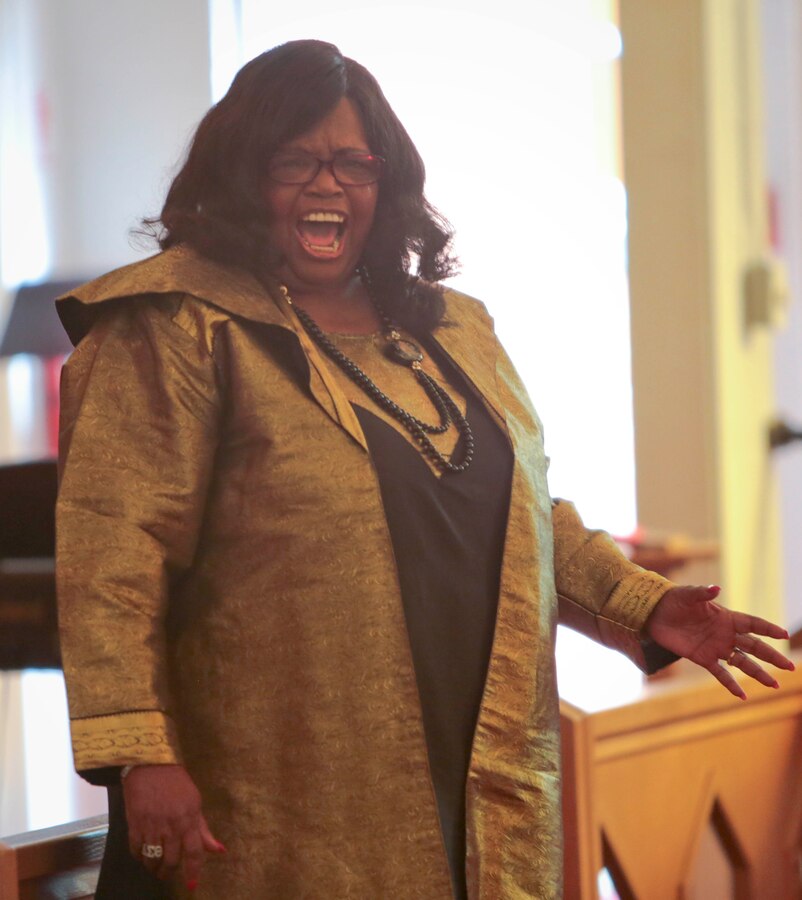 A standing-room-only crowd gathered in the Base Chapel aboard Marine Corps Logistics Base Albany for the annual Dr. Martin Luther King Jr., observance ceremony, Jan. 16.  Individuals listened intently, with varying looks of dismay, pain, shock and disbelief on their faces, as Dr. Shirley Green-Reese, one of the original Leesburg Stockade Girls, shared her story. (U.S. Marine Corps photo by Jennifer Parks)