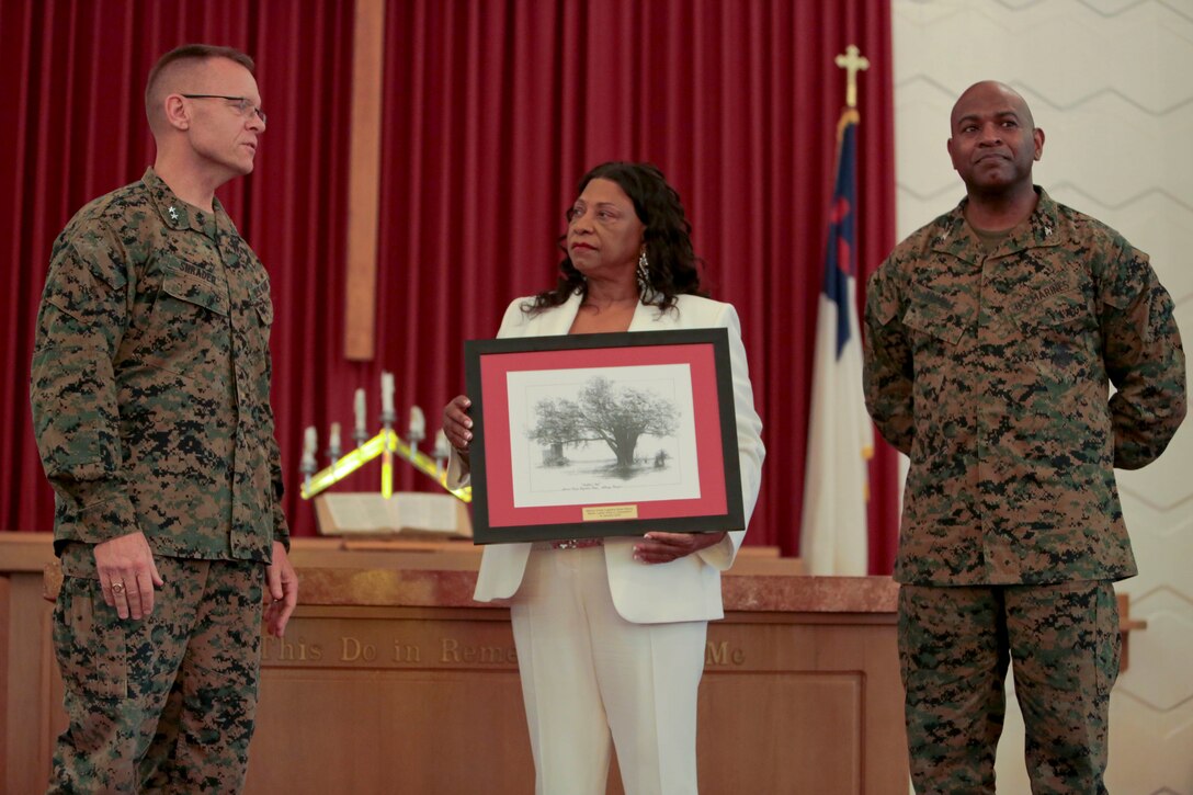 A standing-room-only crowd gathered in the Base Chapel aboard Marine Corps Logistics Base Albany for the annual Dr. Martin Luther King Jr., observance ceremony, Jan. 16.  Individuals listened intently, with varying looks of dismay, pain, shock and disbelief on their faces, as Dr. Shirley Green-Reese, one of the original Leesburg Stockade Girls, shared her story. (U.S. Marine Corps photo by Jennifer Parks)