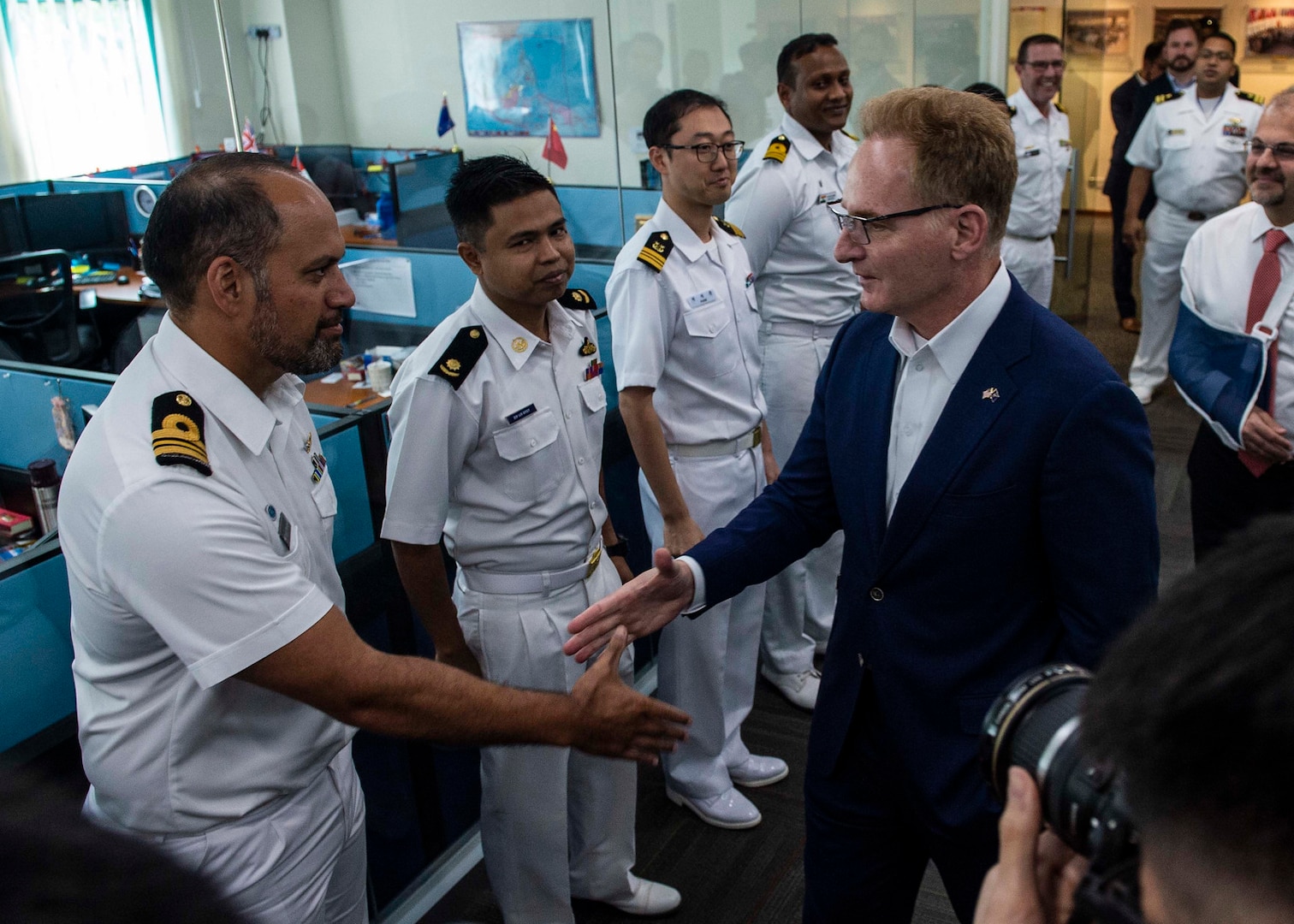 200114-N-FV739-0037\rCHANGI NAVAL BASE, Singapore (Jan. 14, 2019) Acting Secretary of the Navy Thomas B. Modly meets with international liaison officers during a tour of the Information Fusion Centre. Modly�s visit to Singapore is part of a multination visit to the U.S. Indo-Pacific areas of responsibility focused on reinforcing existing partnerships and visiting Sailors and Marines providing forward presence. (U.S. Navy photo by Mass Communication Specialist 2nd Class Christopher Veloicaza/Released)