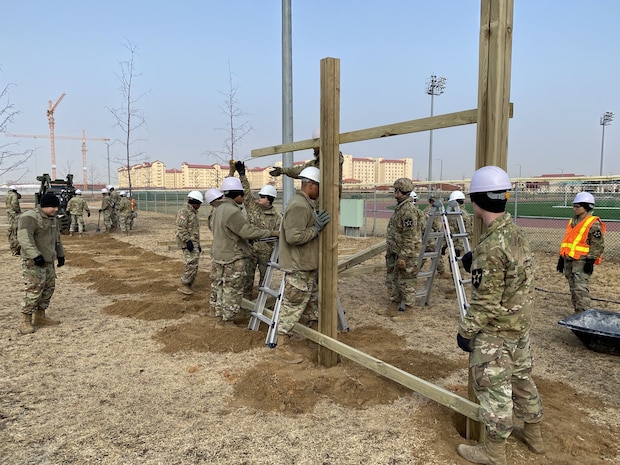 Engineers from 3rd Vertical Engineer Platoon, 643rd Engineer Support Company, install pull-up bars Jan. 14, 2020 at Balboni Field on Camp Humphreys, South Korea.