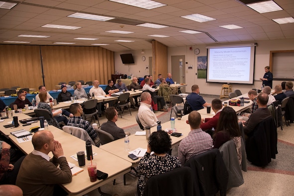 PETERSON AIR FORCE BASE, Colo. – Maj. Pamela Potter, 302nd Airlift Wing process manager, briefs continuous process improvement to 302 AW commanders and senior enlisted Reserve Citizen Airmen during the semi-annual strategic alignment event, Jan. 13, 2020, at Peterson Air Force Base, Colorado. The event brings together the wings commanders and senior enlisted to discuss their successes and challenges last year and how they will overcome readiness challenges this coming year through continuous process improvement. (U.S. Air Force photo by Staff Sgt. Tiffany Lundberg)