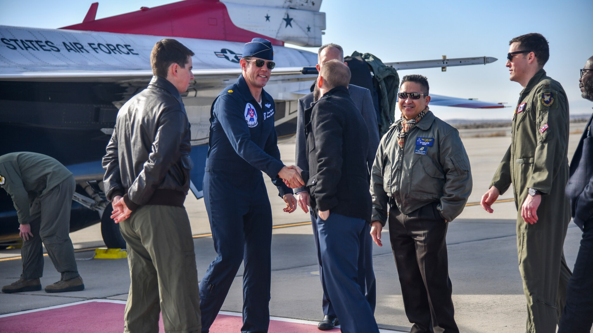 Air Force Thunderbird jet #8 pilot, Maj. Jason Markzon, meets with Aerospace Valley Air Show officials at Edwards Air Force Base, California, Jan. 16. Markzon, the advance pilot and narrator for the Thunderbirds Flight Demonstration Squadron, visited different base facilities at Edwards to conduct a site survey ahead of their performance at the 2020 Aerospace Valley Air Show, Oct. 10-11. (Air Force photo by Giancarlo Casem)
