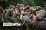 Photo of Marines with MilTax logo superimposed on it