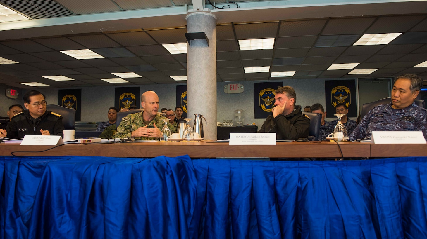YOKOSUKA, Japan (January 17, 2019) - Commander, U.S. 7th Fleet Vice Adm. Bill Merz (center left), greets Royal Australian Navy Rear Adm. Jonathan Dallas Mead (right), Japan Maritime Self-Defense Force (JMSDF) Vice Adm. Hiroyuki Kasui (left), and Republic of Korea Navy Vice Adm. Lee Sung-Hwan (center right) aboard the 7th Fleet flagship USS Blue Ridge (LCC 19) for a Fleet Commanders Round Table. The meeting provided a forum to engage in professional dialogues on various maritime issues such as multilateral exercises, freedom of navigation operations and maritime law, rules and norms.