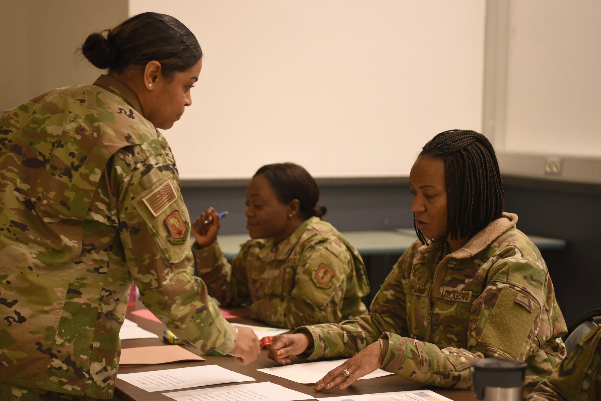 U.S. Air Force Master Sgt. Alejandra Jones, Headquarters U.S. Air Forces Europe-Air Forces Africa commander's quarters staff superintendent, talks with attendees during the monthly Let’s Connect session at the Kaiserslautern Military Community Center, Ramstein Air Base, Germany, Jan. 14, 2020.