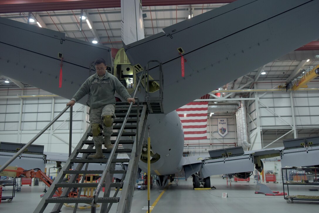 Airman 1st Class Robert Thach, 100th Maintenance Squadron aircraft structural maintenance journeyman, retrieves his tools before beginning maintenance on a KC-135 Stratotanker at RAF Mildenhall, England, Jan. 14, 2020. Aircraft structural maintenance Airmen are occasionally sent to recover aircraft and bring them back. (U.S. Air Force photo by Senior Airman Benjamin Cooper)
