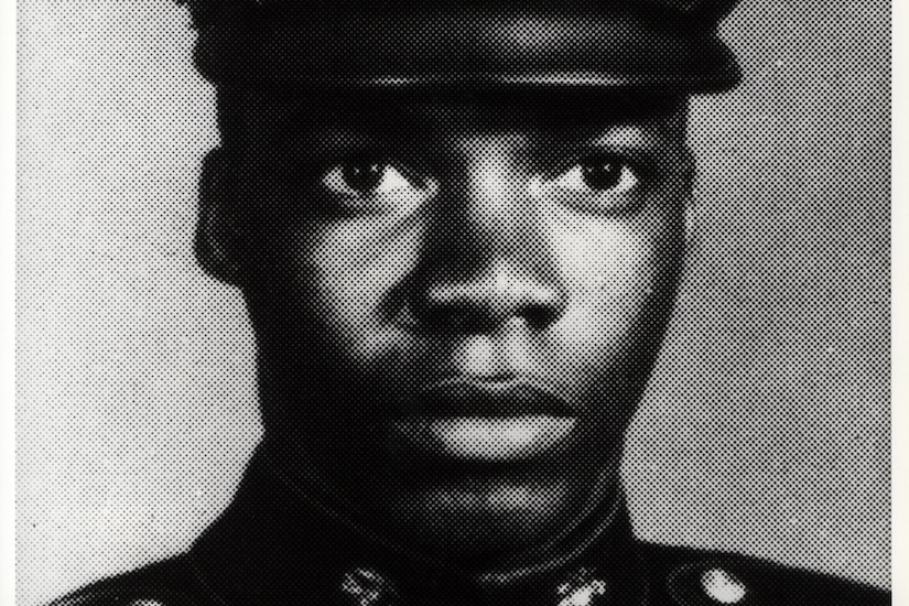 A young Marine wears his dress cap.