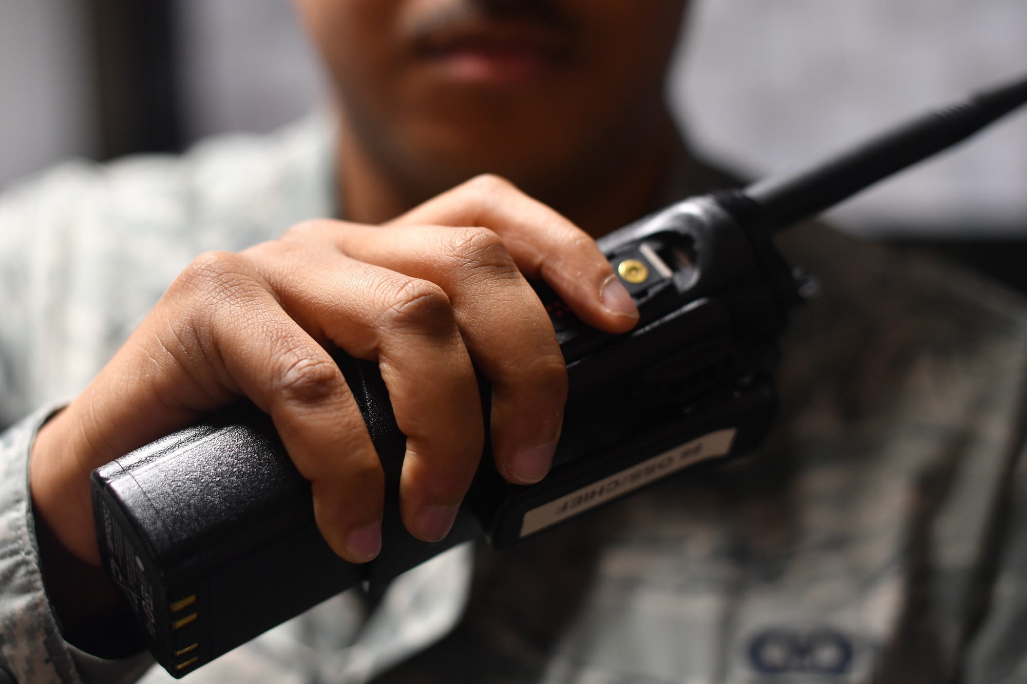 U.S. Air Force Senior Airman Evan Hadnot, 86th Operations Support Squadron airfield management shift lead, responds to airfield reports over a radio on Ramstein Air Base, Germany, Jan. 10, 2020.