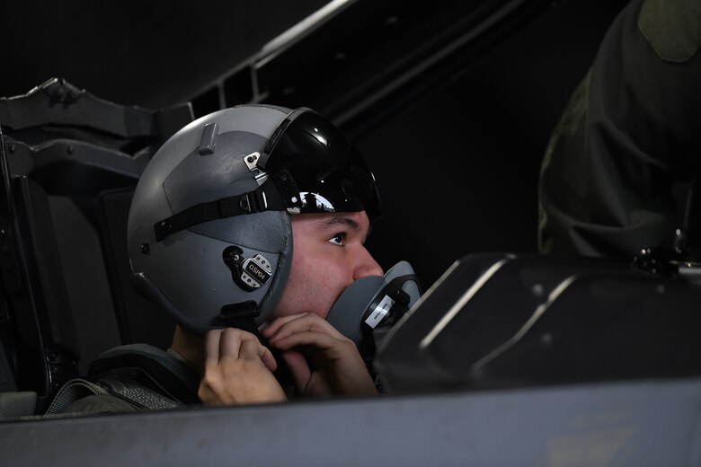 Civil Air Patrol Cadet Colonel Zane Fockler tightens his helmet in preparation for his familiarization flight at Royal Air Force Lakenheath, England, January 10, 2019. Flockler was awarded the highest prestigious award in the Civil Air Patrol, the Gen. Carl A. Spaatz Award, for demonstrating excellence in leadership, character, fitness, and aerospace education. (U.S.Air Force photo by Senior Airman Shanice Williams-Jones)