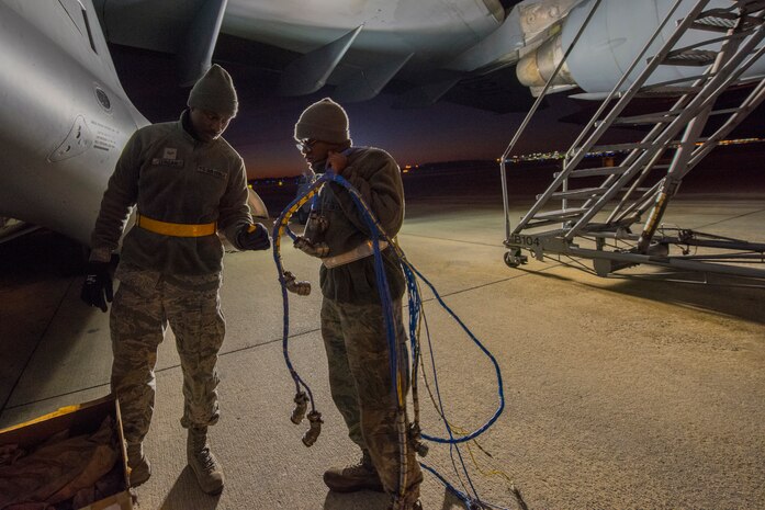 Senior Airman Markevis Duncan and Airman 1st Class George Boyd, 437th Aircraft Maintenance Squadron, aerospace propulsion specialists, pack up the old electrical wire harness from a C-17 engine Jan. 7, 2020, at Joint Base Charleston, S.C